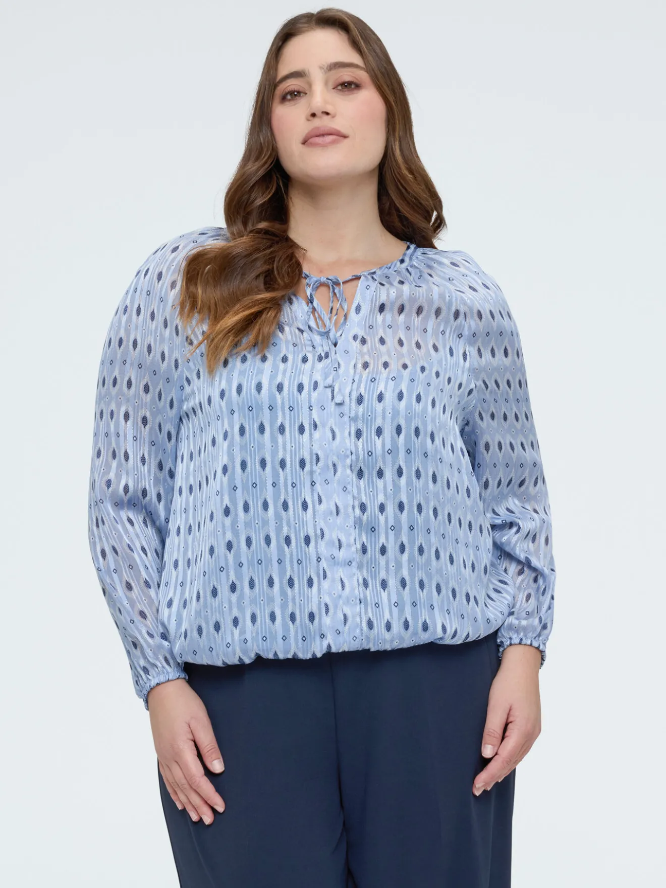 Blusa in tessuto lurex con stampa